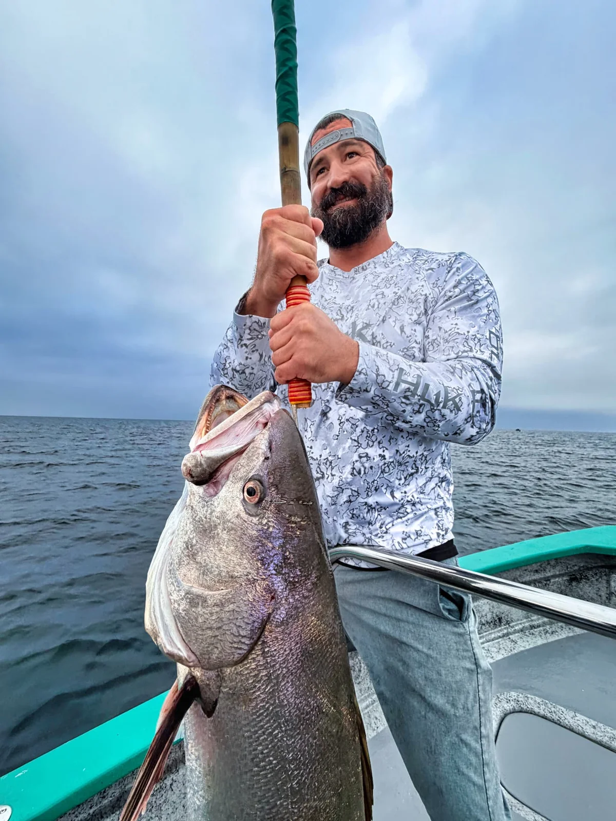 An angler with a sheephead aboard the panga.