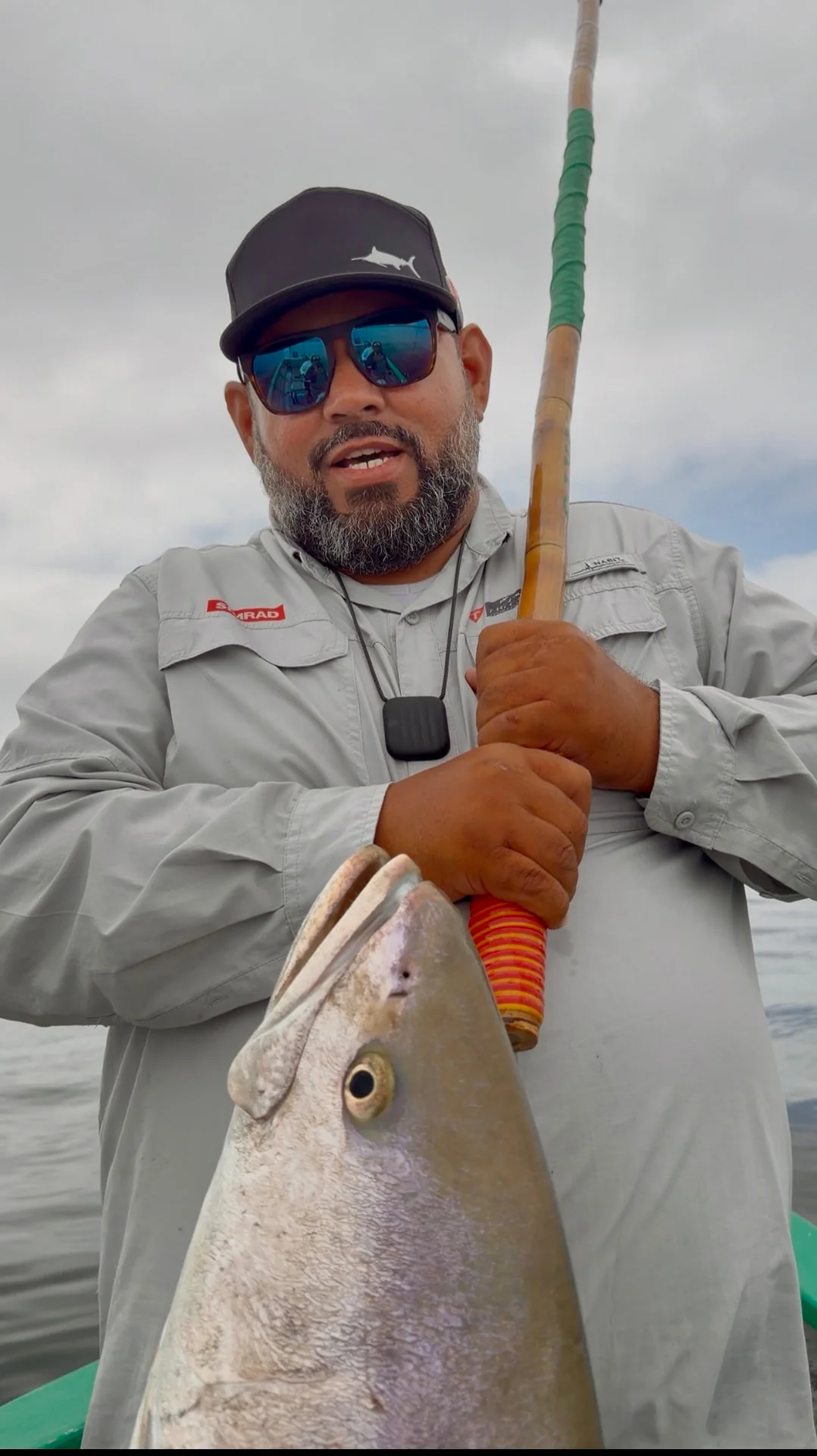 An angler with a white seabass aboard the panga at Cedros.