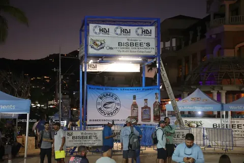 Bisbee’s tournament tower and anglers beside the Cabo San Lucas marina at dusk.